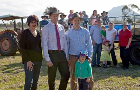 VITAL CAUSE: Heather Wehl shows Lawrence Springborg, Jon Krause and his son Rory what family life is like on the Rosevale farm, where a fundraiser will be held in aid of melanoma research. Source: Queensland Times
