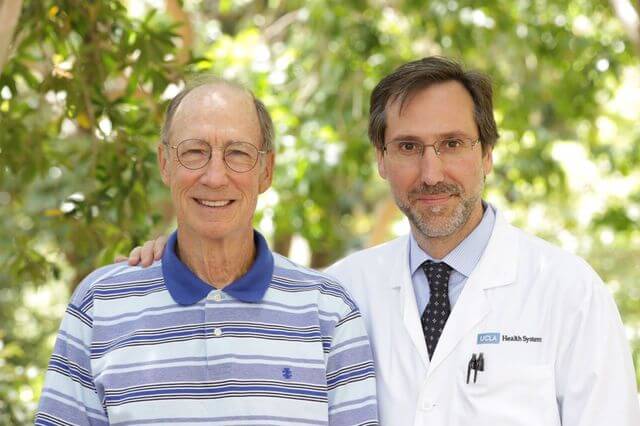 UCLA's Dr. Antoni Ribas (right) with Tom Stutz, whose health improved dramatically after treatment with the newly approved drug