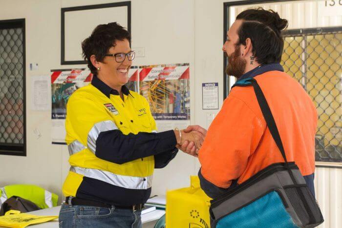 Photo: Jo Crotty speaks to a construction worker after a presentation in South Brisbane. (612 ABC Brisbane: Jessica Hinchliffe) Source: ABC News